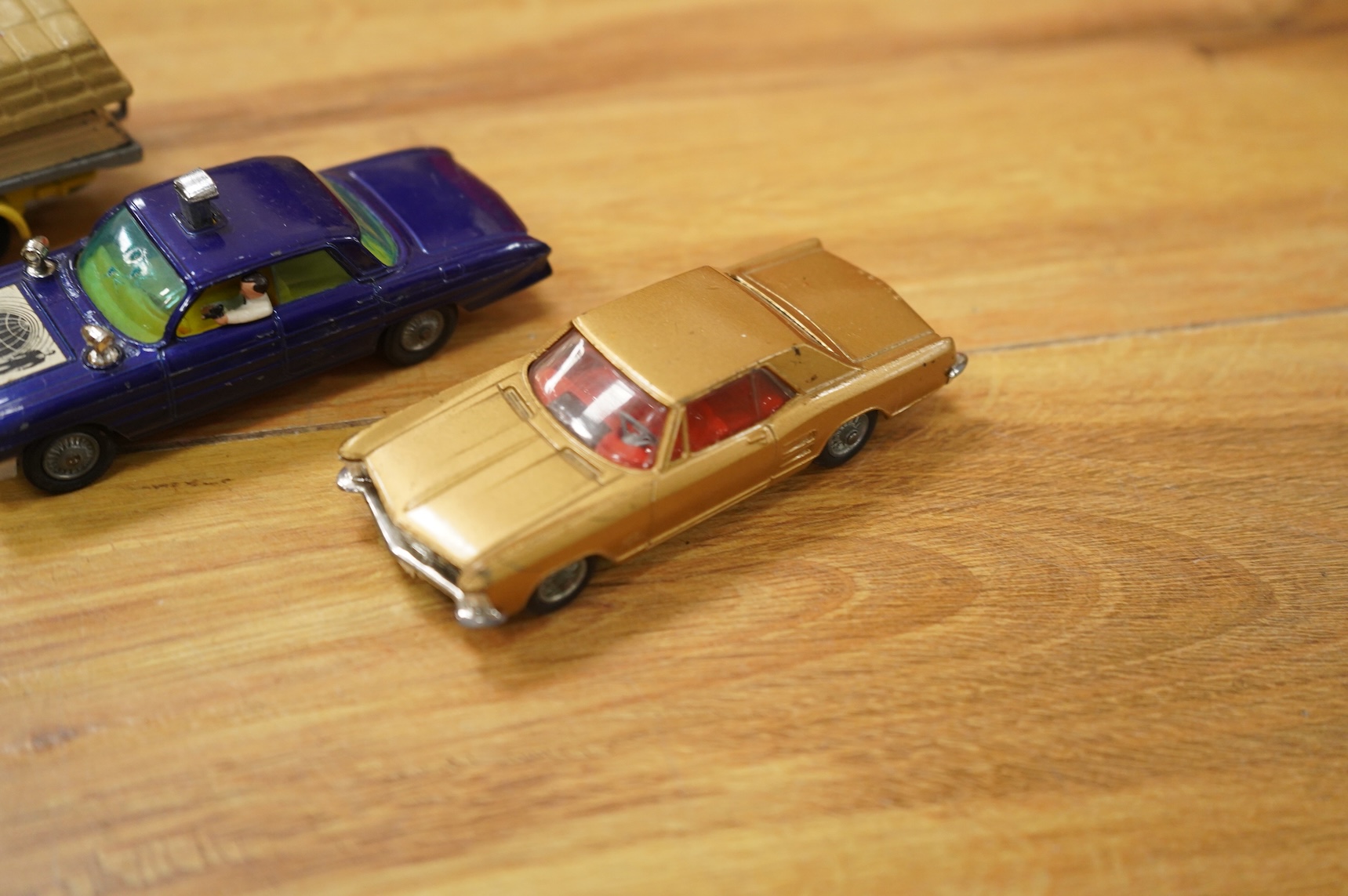A collection of forty Corgi Toys and fourteen Matchbox Series diecast vehicles, including; The Man From Uncle Oldsmobile, a James Bond Aston Martin DB5 in gold, a Commer 5-ton truck with trailer and a selection of loads,